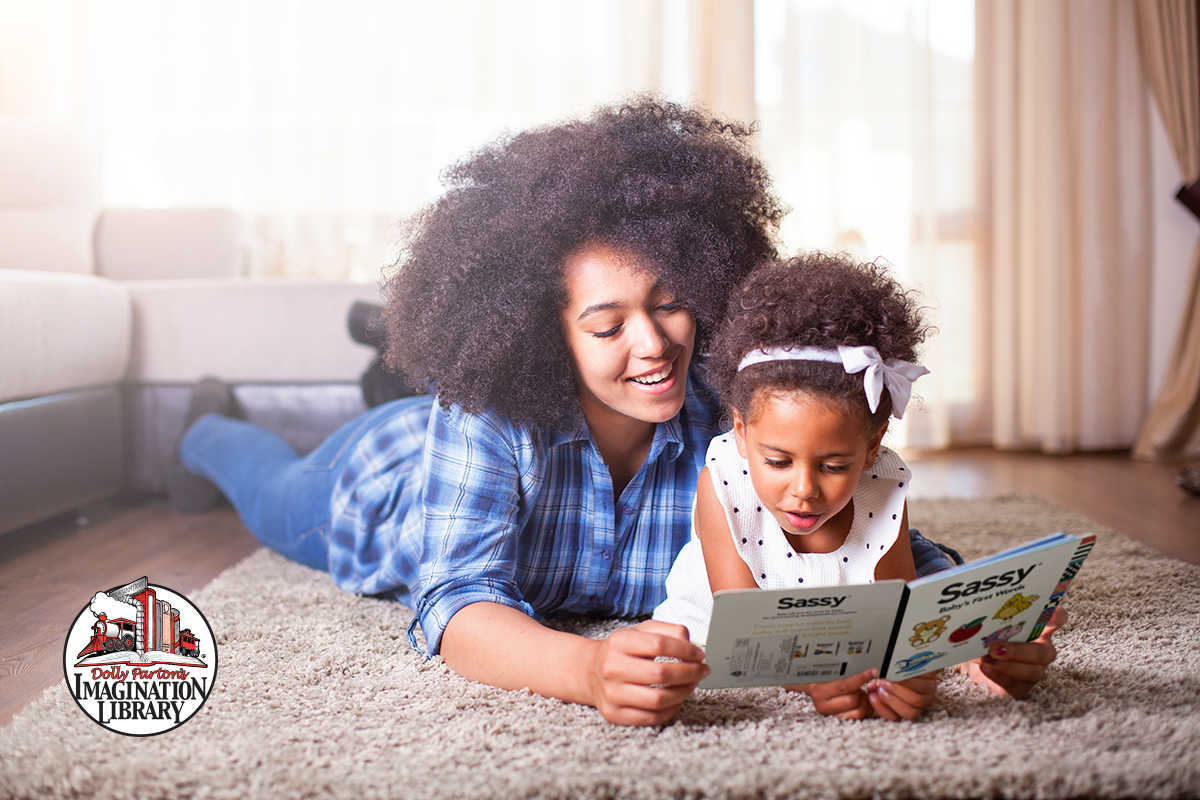 Mother and daughter reading an Imagination Library book together